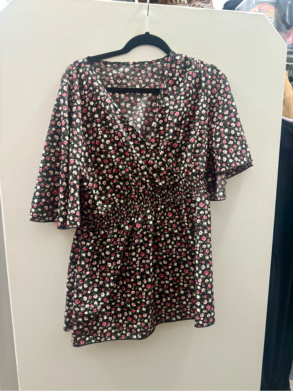 Size XL floral blouse.